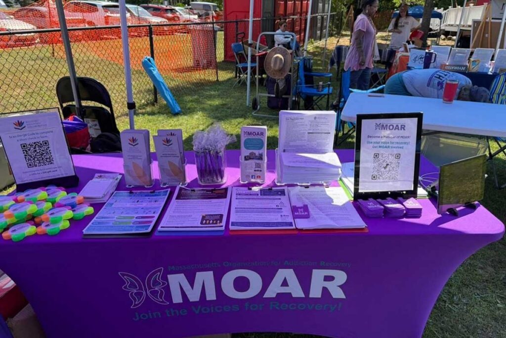 Table set up at an event with information about MOAR