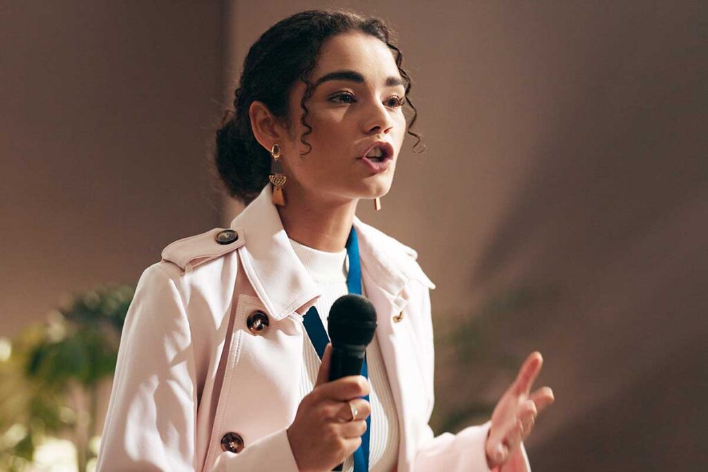 Woman speaking in front of people