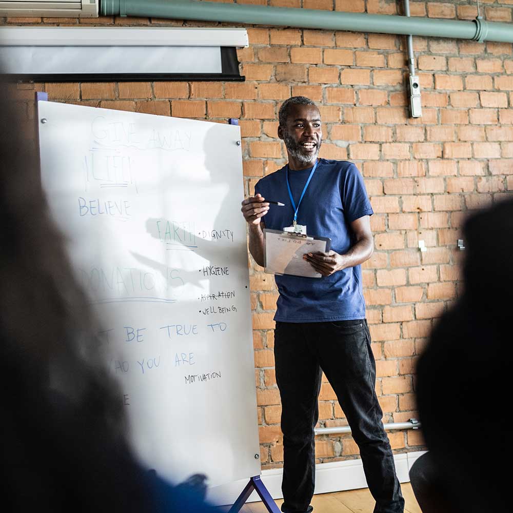 Mature man talking in a meeting at a community center